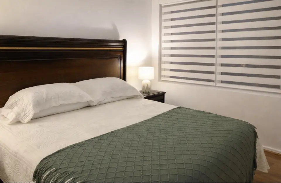 Cama king del departamento amoblado Depto B en Chillán