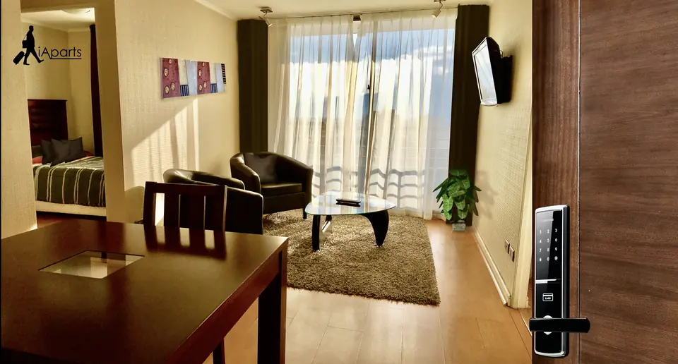 Living and dining area of a furnished two-bedroom apartment in downtown Rancagua